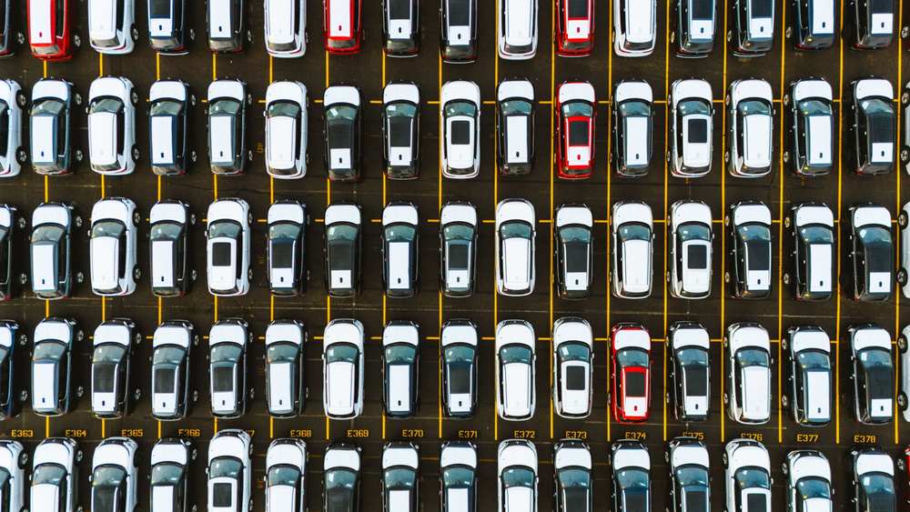 used cars in car park aerial shot